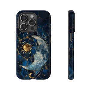 May include: A blue and gold phone case featuring a crescent moon and sun design. The case has a geometric pattern and a starry background.