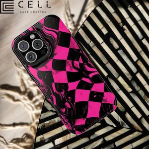 May include: Black and pink checkered phone case with a glossy finish. The case features a bold checkerboard pattern with a swirling design. The phone case is a protective accessory for a smartphone.