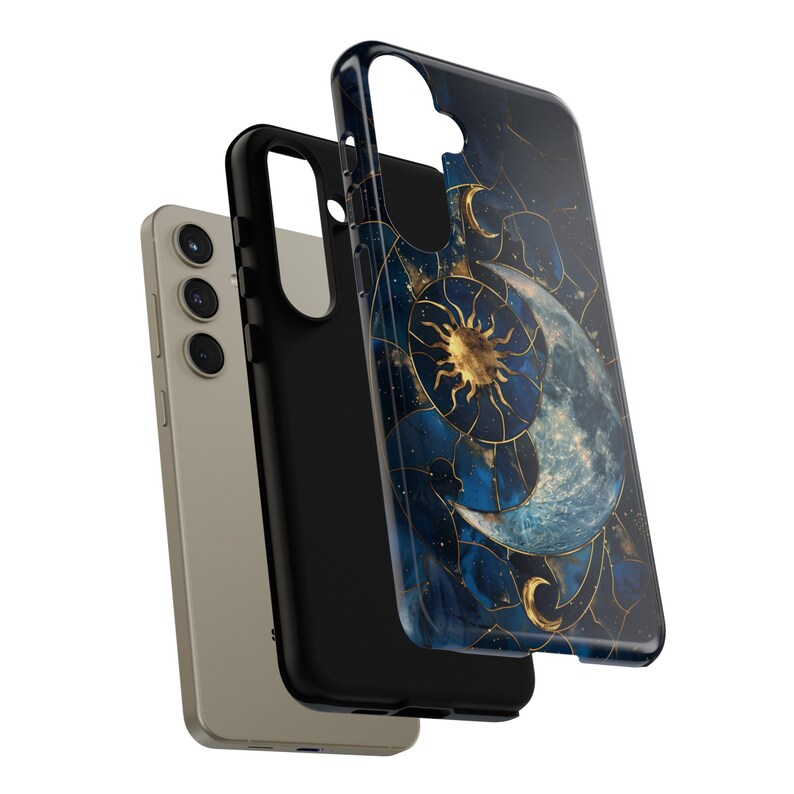 May include: A black phone case with a blue and gold design featuring a sun and moon with stars. The case is shown with a beige phone case.