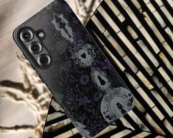 May include: Black phone case with a floral and silhouette design. The case features a dark background with purple floral accents and gray silhouettes. The text "IPHONE | GALAXY | PIXEL" is at the bottom, and the brand name "CELL CASE CRAFTER" is at the top.