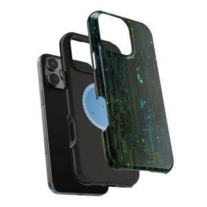 May include: A black smartphone with a protective case. The case has a green and blue circuit board design. The phone is shown with the case partially removed, revealing a blue circular element.