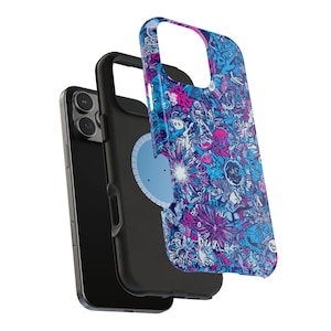 May include: Black smartphone with a black protective case and a detached case cover. The cover has a detailed pattern in blue, pink, and white. The design is a collage of cartoon-like illustrations.
