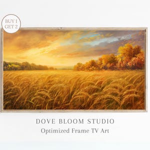 May include: A framed painting of a golden wheat field at sunset. The sky is a mix of orange, yellow, and blue with clouds. Trees line the edge of the field. The painting is titled "Dove Bloom Studio Optimized Frame TV Art".