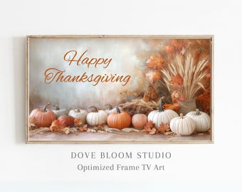 May include: A framed print with the text "Happy Thanksgiving" in orange lettering. The print features a still life of pumpkins and wheat stalks in a rustic setting.