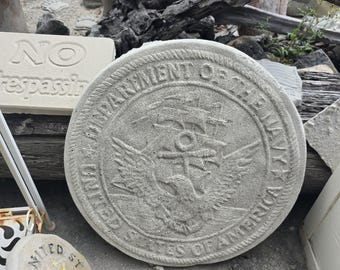 Hand made cement department of the navy walking stone