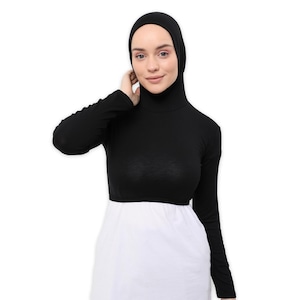 May include: A black long-sleeved mock neck shirt with a high neckline. The shirt is made of a soft, stretchy fabric and has a fitted silhouette.