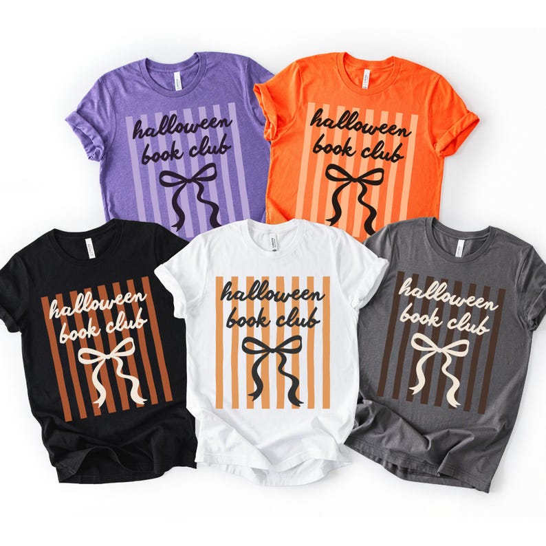 May include: A collection of six t-shirts in various colors: purple, orange, black, white, and gray. Each shirt features the text "Halloween book club" with a bow design and vertical stripes.