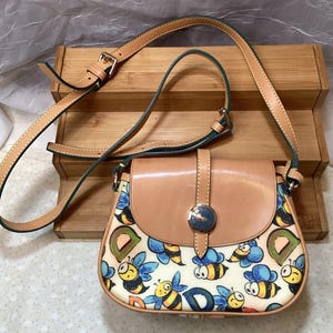 Dooney & Bourke vintage Tan and Multicolor Bee Print Backpack dooney bourke bee products for sale | eBay main image 2