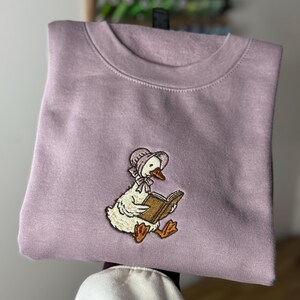 Lilac Reading Duck Jumper • Women’s Cottagecore Book Lover Sweater • Embroidered Gift