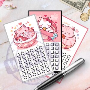 May include: Three pink cat-themed checklist cards with different illustrations, including a cat in a bowl, a cat with a bow, and a cat holding a ball. A silver pen rests on the cards. The cards have a grid of squares for checkmarks.