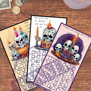 May include: Three colorful savings challenge cards with skull illustrations and candles. The cards have a series of boxes for tracking savings goals. One card reads "Dead serious about saving", another says "No need to die for dessert - just save for it!"