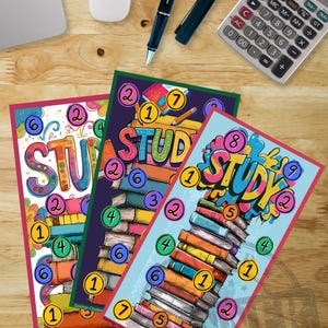 May include: Three colorful "Study" themed cards with stacks of books and numbered circles. A laptop, mouse, pen, and calculator are on a wooden desk. The cards are designed for a savings challenge.