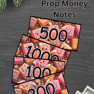 May include: Fudge Prop Money Notes with denominations of 100, 200, 500, and 1000. The notes feature cartoon fudge illustrations. The background is a dark gray wood grain. Real one hundred dollar bills are in the lower right corner.