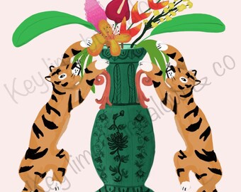 May include: Two orange and black striped tigers are climbing a green vase with a floral design. The vase is filled with orange, yellow, red, and pink flowers.