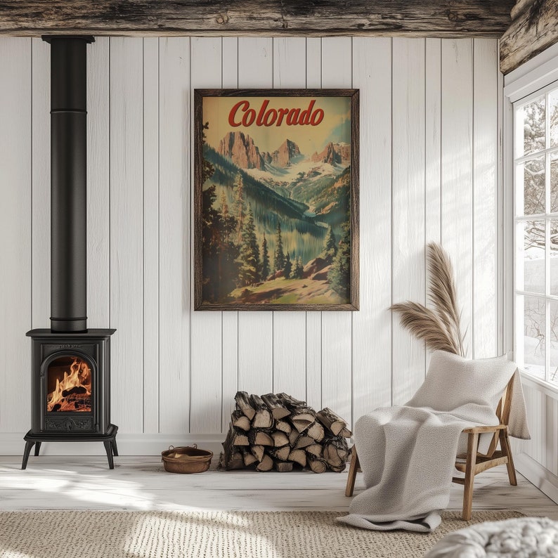 May include: A cozy interior scene featuring a black cast iron stove with a burning fire, a framed vintage poster with "Colorado" text, a wooden chair with a blanket, and a stack of firewood. The room has white paneling and a window.