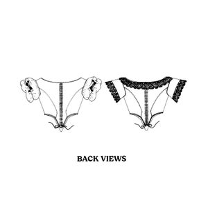 May include: Back views of two white collars with a lace trim. One collar has a ruffled trim and the other has a lace trim. The collars are both fastened with a zipper down the back.