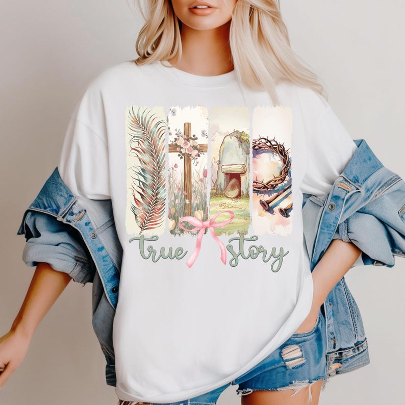 Puede incluir: Camiseta blanca con un dise&ntilde;o gr&aacute;fico de una cruz, una corona de espinas, una tumba y una rama de palma. El gr&aacute;fico est&aacute; rodeado por un efecto acuarela y el texto "true story" est&aacute; impreso debajo del gr&aacute;fico.