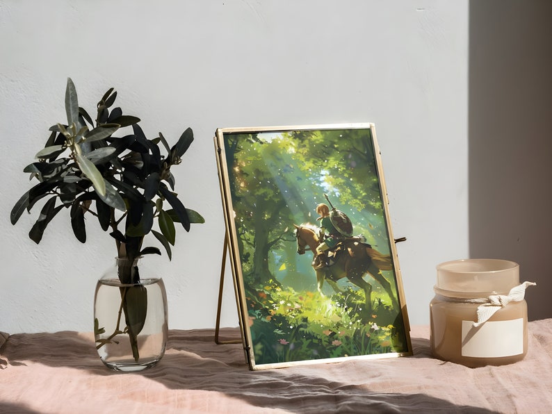 May include: A gold-framed picture of a cartoon character riding a horse through a forest. The picture is on a gold easel and is sitting on a pink surface. There is a candle in the background.