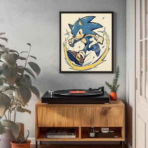 May include: A retro-style illustration of Sonic the Hedgehog running with a yellow lightning bolt effect. The image is framed and displayed on a wall above a record player.