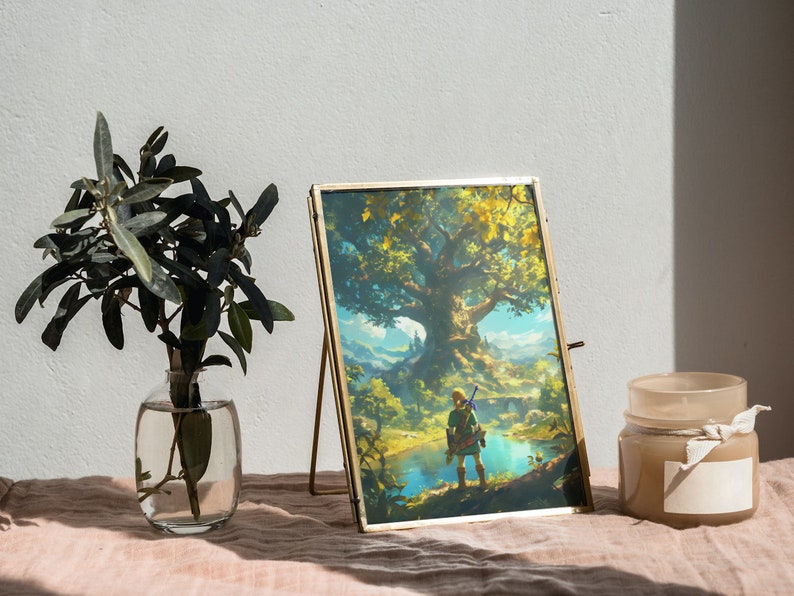 May include: A gold-framed picture with a fantasy landscape scene. The picture shows a character standing in front of a large tree and a lake. The picture is on a table with a vase of greenery and a candle.