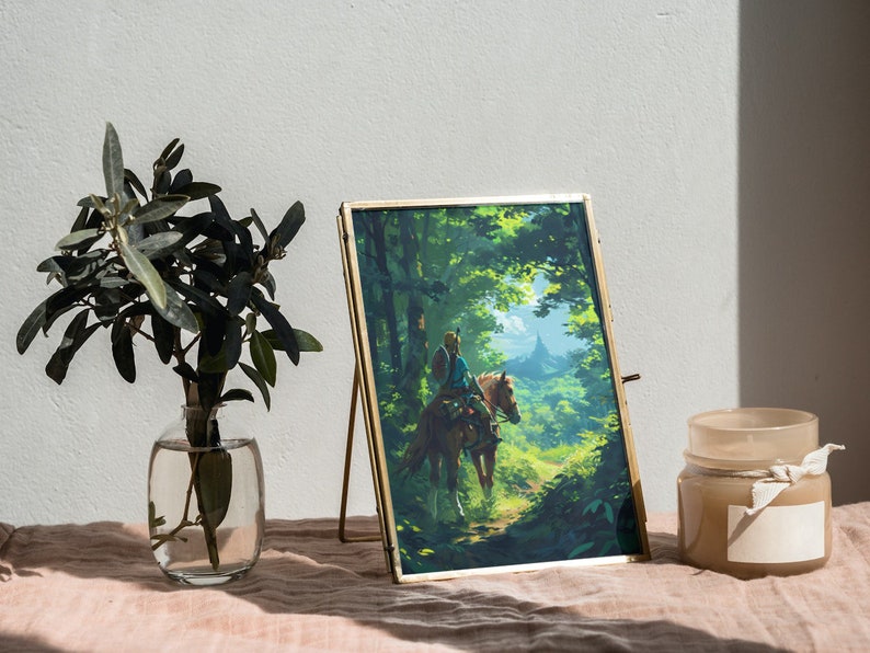 May include: A framed print of a video game character riding a horse through a forest. The print is in a gold frame and is sitting on a table with a candle and a vase of greenery.
