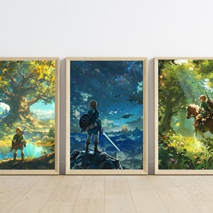 May include: Three framed prints depicting scenes from the Legend of Zelda: Breath of the Wild video game. The first print shows a large tree with a green, blue, and brown landscape. The second print shows a character standing on a cliff overlooking a blue and green landscape. The third print shows a character riding a horse through a forest.