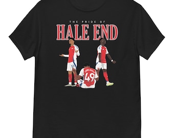 May include: Black t-shirt featuring a white graphic of three football players in red and white kits. The text "THE PRIDE OF HALE END" is printed in white above the players.