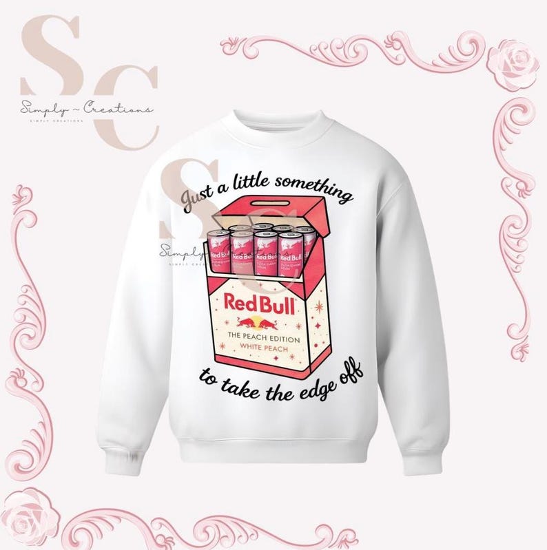 May include: White sweatshirt with a graphic of a Red Bull box containing six cans. The box is red and white with the text "Red Bull The Peach Edition White Peach" and the phrase "Just a little something to take the edge off."