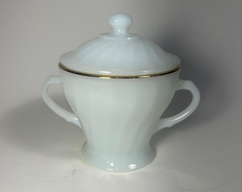 Vintage Anchor and Hocking milk glass covered sugar dish swirl pattern with gold rim.