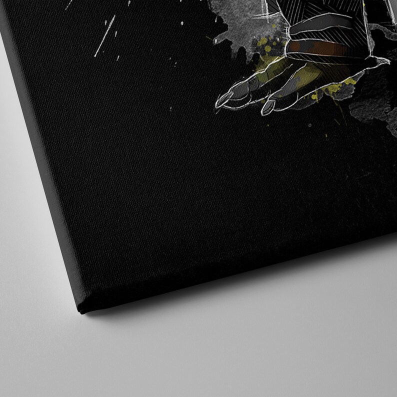 May include: A black canvas print with a white and gray illustration of a hand reaching out. The hand is surrounded by splatters of green and yellow paint.
