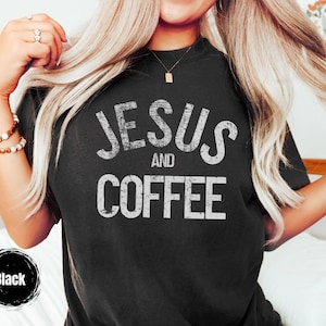 May include: Black t-shirt with the text "JESUS and COFFEE" in distressed white lettering. The shirt is a crew neck style. A black circle with the word "Black" is in the lower left corner.