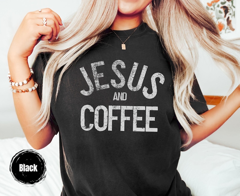 May include: Black t-shirt with the text "JESUS and COFFEE" in distressed white lettering. The shirt is a crew neck style. A black circle with the word "Black" is in the lower left corner.