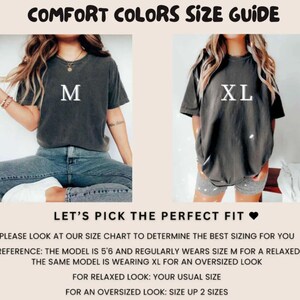 May include: Image shows a Comfort Colors size guide. Two models are wearing dark gray t-shirts, one labeled "M" and the other "XL." Text advises to consult the size chart for the best fit. For a relaxed fit, order your usual size; for an oversized look, size up two sizes.