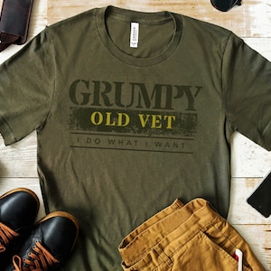 May include: A green t-shirt with the text "GRUMPY OLD VET I DO WHAT I WANT" in yellow and black lettering.