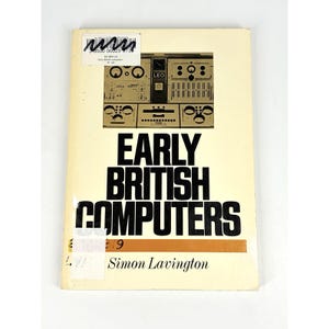 May include: A softcover book titled Early British Computers by Simon Lavington. The cream-colored cover features a black-and-white photograph of a LEO computer control panel, with bold black text and a library sticker on the top left corner.