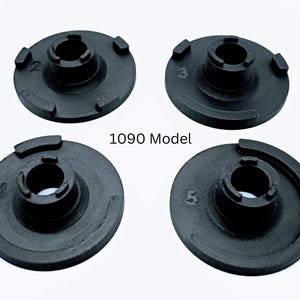 May include: Four black circular components with central openings and raised sections. Each component is marked with a number: 2, 3, 4, and 5. The text "1090 Model" is printed in the center.