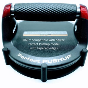 May include: Black Perfect Pushup device with a textured handle and red accents. The base has the words "Perfect PUSHUP" and text that reads "ONLY compatible with newer Perfect Pushup model with tapered edges."
