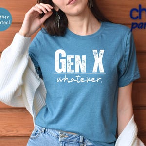 a woman wearing a blue gen x whatever t - shirt