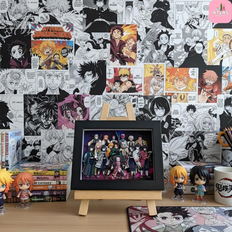 May include: A framed artwork featuring a group of anime characters, displayed on a small wooden easel. The background is a wall covered in black and white manga panels. Anime figurines and manga volumes are also visible.
