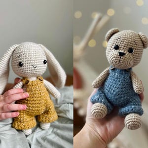 May include: Two crocheted stuffed animals, a bunny and a bear, both wearing overalls. The bunny is white with brown overalls and the bear is beige with blue overalls.