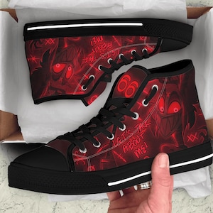 May include: Pair of high-top canvas sneakers with a red and black design. The sneakers feature a repeating graphic and the text "LET'S TALK ABOUT ME!" on a red background. The soles are black with a white stripe.