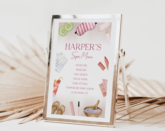 Op de afbeelding: Een zilveren ingelijst bord met een roze en witte spa-menu voor Harper's Spa. Het menu bevat diensten zoals manicure, pedicure, nageldesign, gezichtsmasker, haarstyling, tijdelijke haarkleur en glamour make-up.