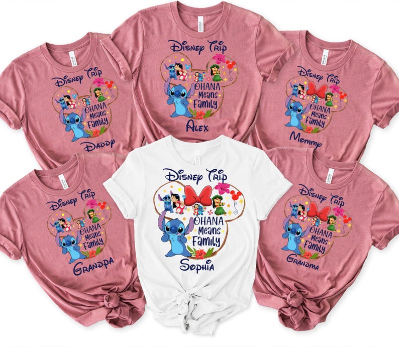 May include: A collection of pink and white t-shirts with a Disney theme. Each shirt features a graphic of Stitch and the phrase "Ohana Means Family" inside a Mickey Mouse head shape. Some shirts have names like "Daddy" and "Mommy".