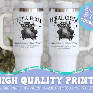 May include: White insulated tumblers with handles, featuring a raccoon graphic on a chair, the text "FIFTY & FERAL" and "FERAL CREW", and the phrase "Anti-Social - Social Club". The tumblers also have the text "Birthday & Crew Tumblers".