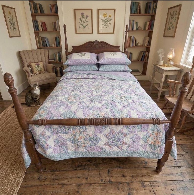 May include: A wooden four-poster bed frame featuring a headboard with carved details, dressed in a quilt with a lavender, blue, and white star-patterned floral print, paired with two matching lavender pillowcases with floral embroidery.