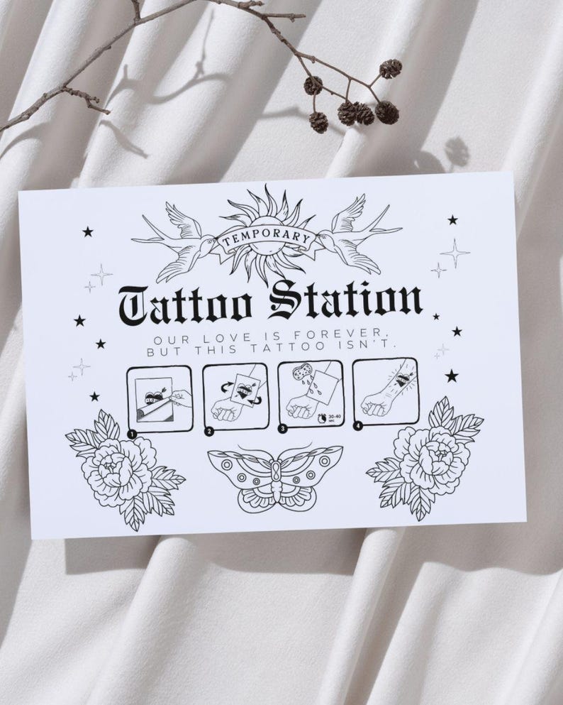 Puede incluir: Ilustraci&oacute;n en blanco y negro de una estaci&oacute;n de tatuajes temporales con un dise&ntilde;o de sol y p&aacute;jaros. El texto dice "Temporary Tattoo Station. Our love is forever, but this tattoo isn't."