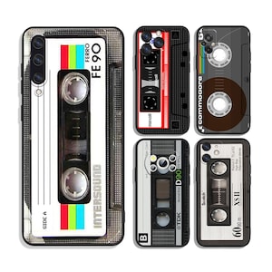 May include: A set of five different cassette tape phone cases. The cases are black with silver accents and feature different cassette tape designs. The cases are all labeled with the brand name and type of tape. The cases are all in a white background.