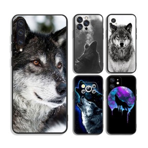May include: Set of five phone cases featuring different wolf designs. The cases are black with a variety of wolf images, including a wolf howling at the moon, a wolf with its head tilted, and a wolf in a snowy landscape.