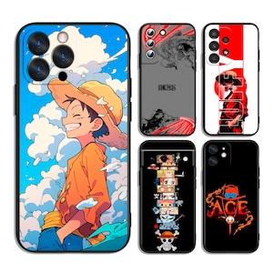 May include: A collection of phone cases featuring anime-style illustrations. Designs include a smiling character in an orange shirt and straw hat against a blue sky, and other cases with character art and text.