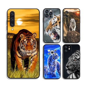 May include: Set of five phone cases featuring different tiger designs. The cases are black with a variety of colorful images of tigers, including a tiger in a sunset, a tiger with its mouth open, a white tiger in a forest, and a white tiger with its mouth open.